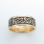 14 karat yellow gold "bendy" knot celtic band with rails.