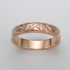14 karat rose gold flat band with spanish-style hand-engraved pattern.