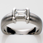Platinum ring with 1.06 ct. radiant-cut diamond in polished "bracket-style" semi-bezel on heavy-duty shank with brushed finish.