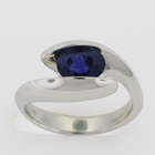 Platinum ring with Color-changing Sapphire in swoopy freeform yin-yang setting.