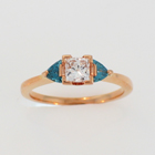 14 karat rose gold ring with a princess-cut diamond and two blue diamond trilliants