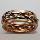 14 karat tri-colored braid band with 14karat rose gold rails.