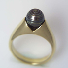 yellow gold ring with rippled black pearl