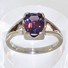 Palladium split-shank ring with cushion-shaped purple Spinell in 4-way semi-bezel