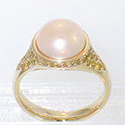 14 Karat Yellow Gold Pearl ring with yellow diamonds