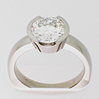 Palladium solitaire ring with 2 ct round brilliant diamond in semi-bezel setting on heavy round shank