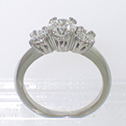 Platinum 3-stone ring with round diamonds in "empire" style 8-prong settings