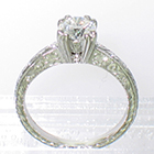 Platinum hand-engraved solitaire with 0.80 carat round brilliant diamond in 8-prong fancy "fishtail" style setting
