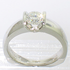 Platinum solitaire ring with 0.72 ct round brilliant diamond channel-set into oversized saddle setting