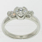 Platinum 3-stone ring with round brilliant diamonds in semi-bezel settings