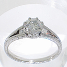 Platinum hand-engraved Split-Shank ring with 0.52 carat round brilliant diamond in fancy 8-prong "crown" style setting with channel-set round brilliant melee diamonds in shank
