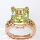 14 Karat Rose gold ring with 8 carat rectangular chrysoberyl in 4-prong setting and round natural yellow melee diamonds bead-set in shank