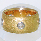 22 Karat Yellow Gold Band with Natural finish and rose-cut round diamonds set in low-profile Platinum bezel settings
