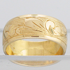 14 Karat Yellow Gold wide band with hand-engraved hawaiian floral design