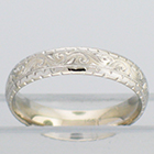 14 Karat White Gold hand-engraved comfort-fit band with western pattern and zig-zag borders