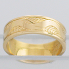14 Karat Yellow Gold flat band with lazy-river hand-engraved pattern