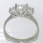 plat.ring w/ 1ct princess diampnd and 2 trapezoid cut side diamonds