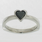 Palladium solitaire with black heart-shaped diamond in full bezel setting