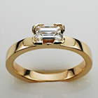 14 karat yellow gold flat band with 0.90 carat emerald-cut diamond in semi-semi-bezel(modified to 4-corners).