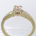14 Karat yellow gold hand-engraved tapered channel ring with 0.67 carat round brilliant diamond in empire-style head
