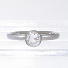 Platinum stacker ring with 0.40 carat rose-cut diamond in full polished bezel with cut-outs to allow band to slide under setting. brushed finish on band (alternate view)
