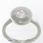 Platinum solitire with 0.55 carat round brilliant diamond in disc bezel on flat band