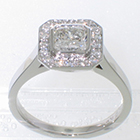 Platinum "halo" ring with 1.01 carat Radiant-cut Diamond in full bezel over 0.24 carat total-weight bead-set halo-plate