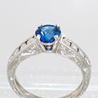 Platinum Hand-engraved 4-prong Sapphire ring with channel-set diamonds