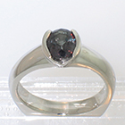 Palladium Oval-shaped Color-changing African Sapphire solitaire ring in semi-bezel setting