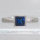 Palladium hand-engraved solitaire ring with princess-cut Sapphire in full bezel setting (alternate view)
