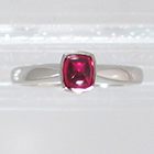Platinum Solitaire ring with cushion-shaped bullet-caboschon-cut Ruby in full bezel setting (alternate view)