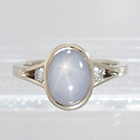 Star Sapphire in full bezel on Split Shank ring with round white diamonds