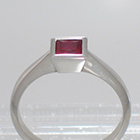 Platinum Solitaire with princess-cut Ruby in full bezel setting