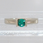 14 Karat White Gold Solitaire ring with round Emerald in Square saddle setting