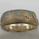 14 karat multi-colored gold band with southwestern theme and sand-blasted finish.