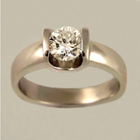platinum ring with round diamond in extra-substantial saddle