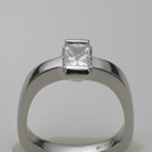 platinum ring with radiant-cut diamond.