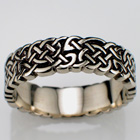 14 Karat white gold celtic "no-rails pretzel" knot band.