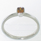 Platinum "stacker" solitaire ring with emerald-cut natural cognac-colored diamond in full bezel setting