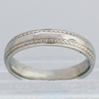 Palladium band with hand-engraved zig-zag borders