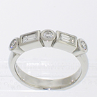 Platinum bezels band with alternating round brilliant and step-cut baguette diamonds
