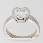 Palladium solitaire ring with 2 ct round brilliant diamond in semi-bezel setting on heavy round shank