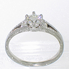 Platinum split-shank ring with 0.55ct round brilliant diamond in 6-prong setting with channel-set round melee diamonds in shank