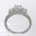 Platinum 3-stone ring with round diamonds in "empire" style 8-prong settings