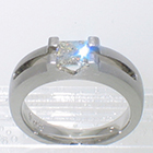 Platinum matte-finished solitaire with princess-cut diamond in angular saddle setting over open channel