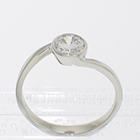 Platinum low-profile wrap-around bezel ring with 0.51 carat round-brilliant diamond set in low bezel (alternate view)
