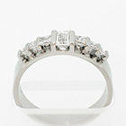 Flat Platinum band with baguette and princess-cut diamonds channel-set between flat rails