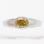 Platinum ring with 0.80 carat oval-shaped natural yellow diamond in full bezel setting