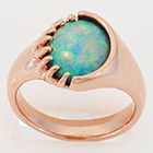 14 karat rose gold freeform opal ring.