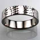 Platinum flat band with "reptile skin" finish.